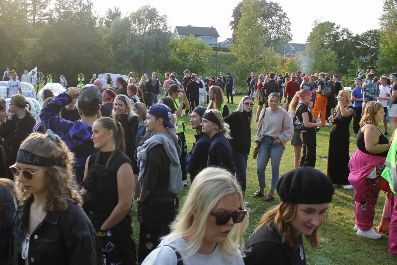 A large group of students standing on a field.